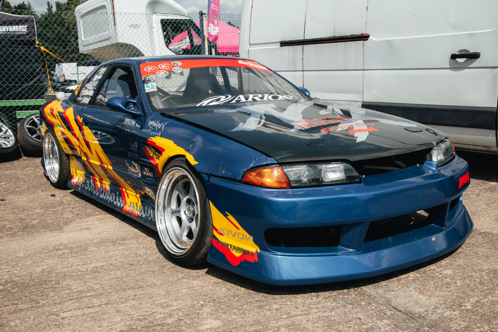 Modified blue drift car in the paddock
